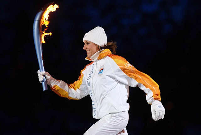 IT_Deborah Compagnoni holding the Olympic torch.